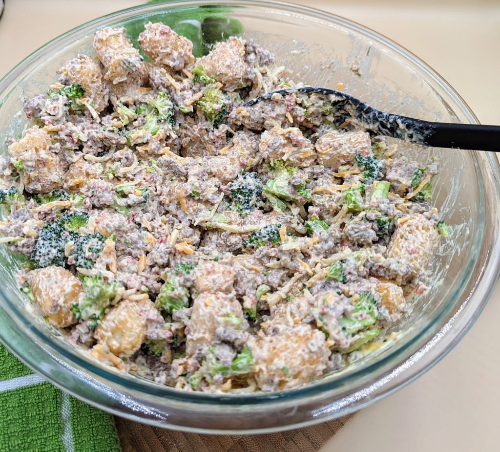 Cracked hamburger hash casserole all mixed together in bowl