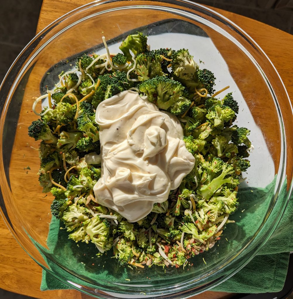 adding dressing to bowl