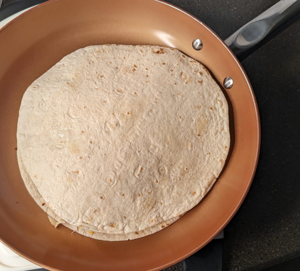 Assembled Chicken Bacon Ranch Quesadilla in frying pan