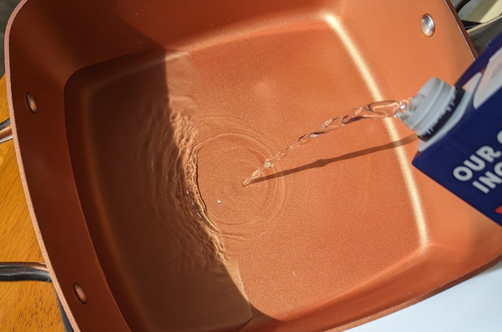 pouring broth into pot