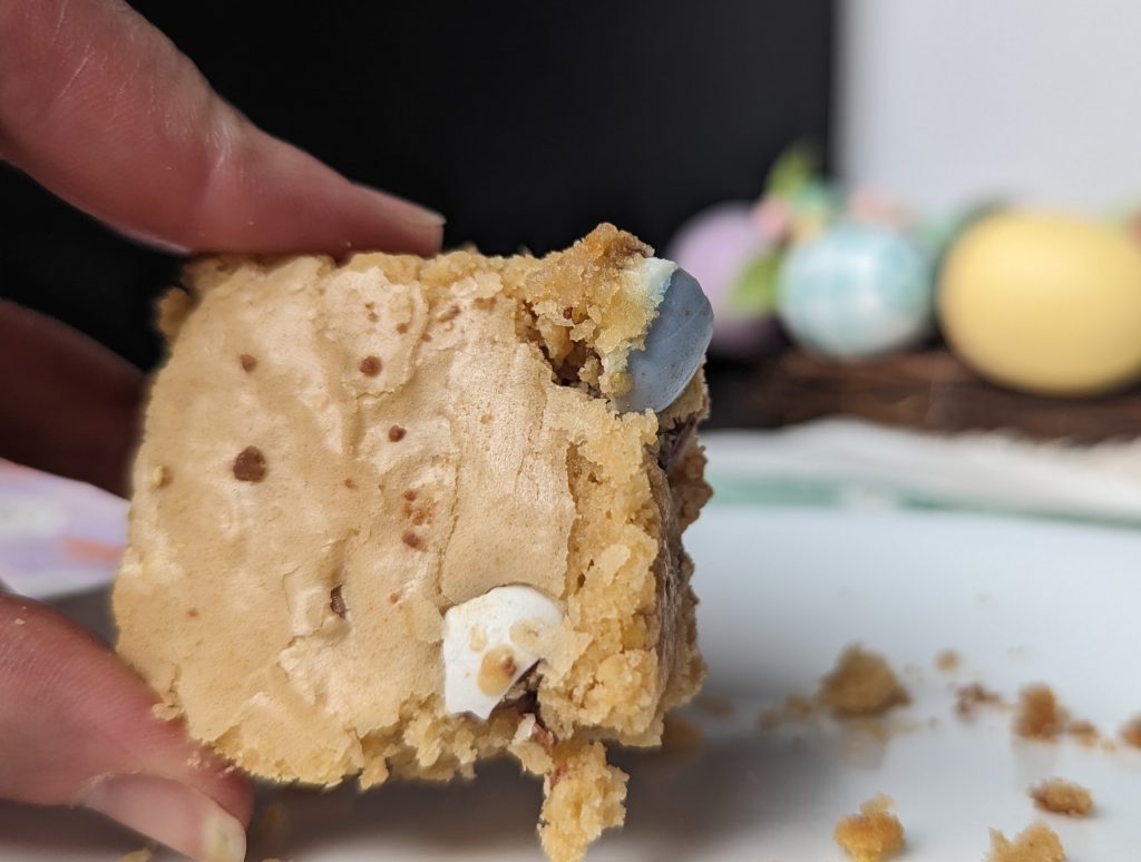 hand holding a serving of mini Egg Cookie Bars