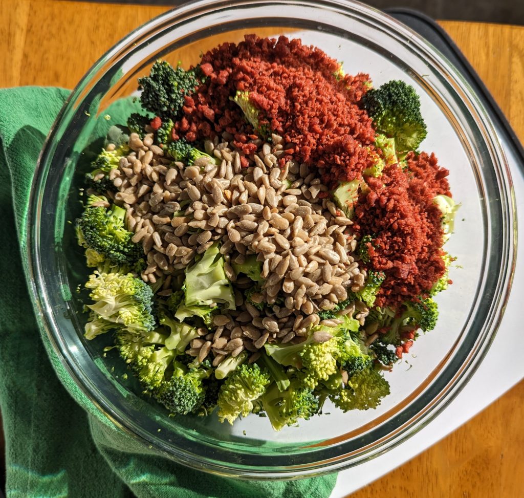 broccoli crunch salad ingredients in bowl