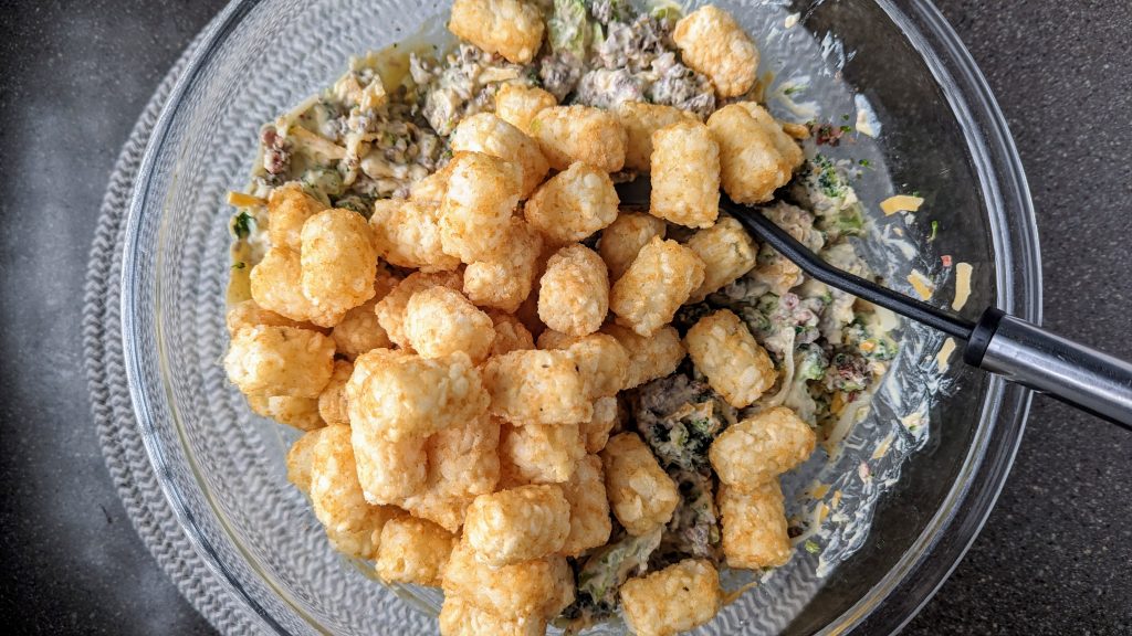 adding tator tots to the bowl