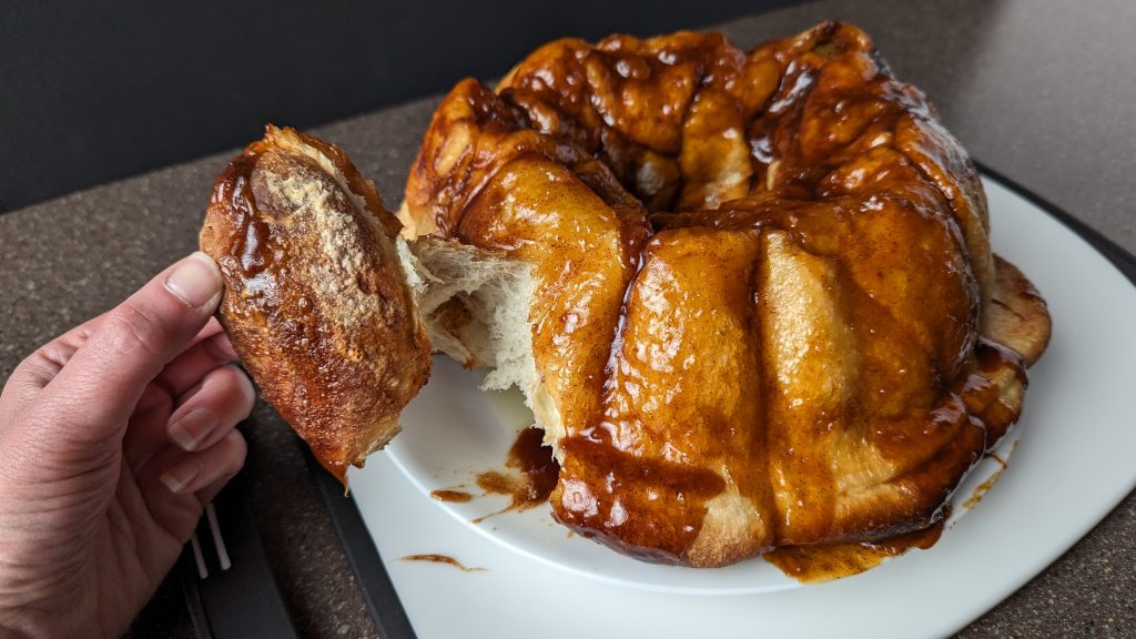 pulling apart a piece of Make Ahead Monkey Bread