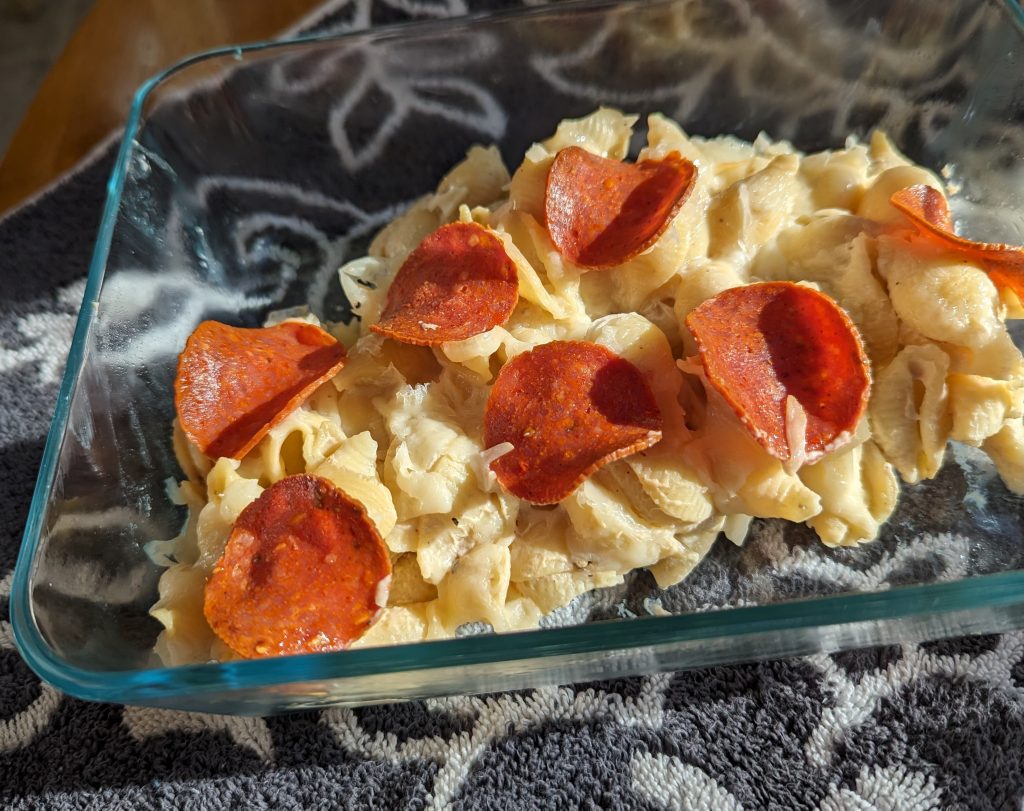 serving of pepperoni alfredo bake in dish