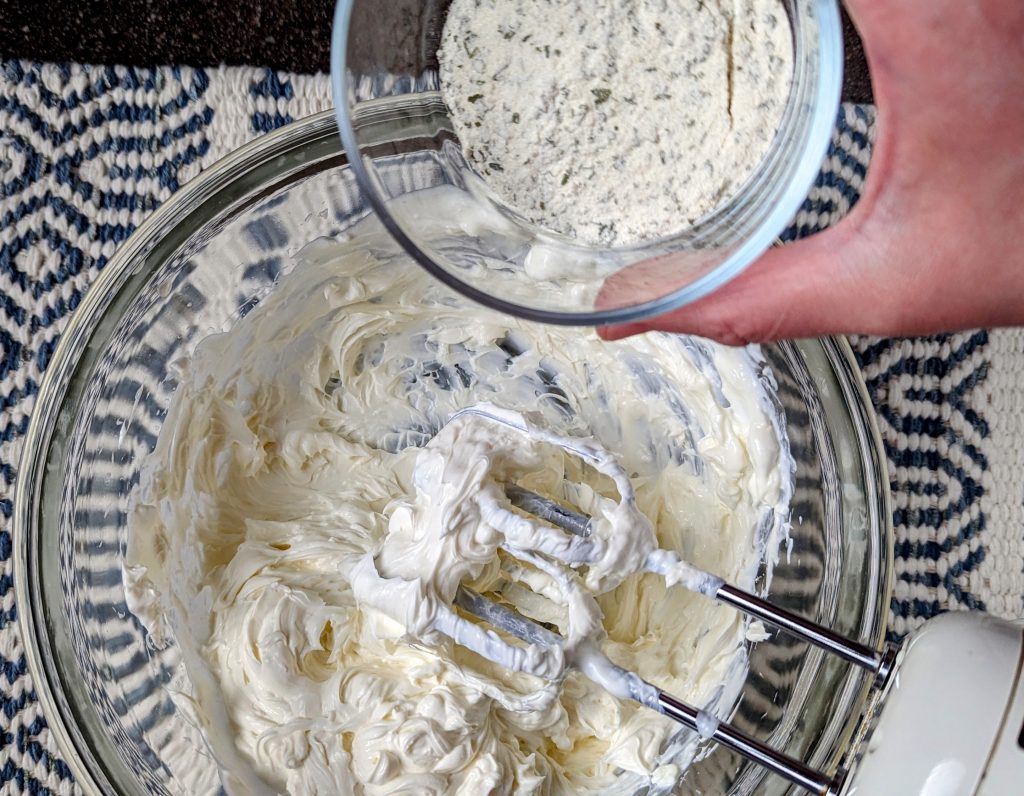 adding ranch mix to the bowl