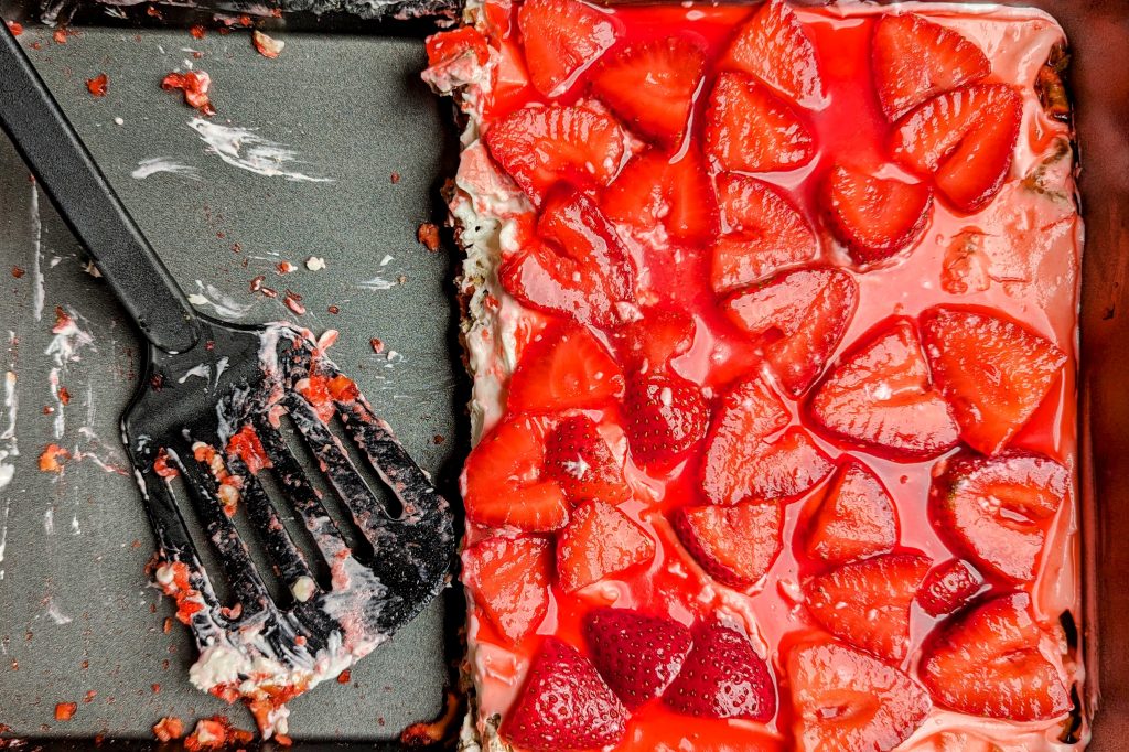 strawberry pretzel delight in pan with spatula