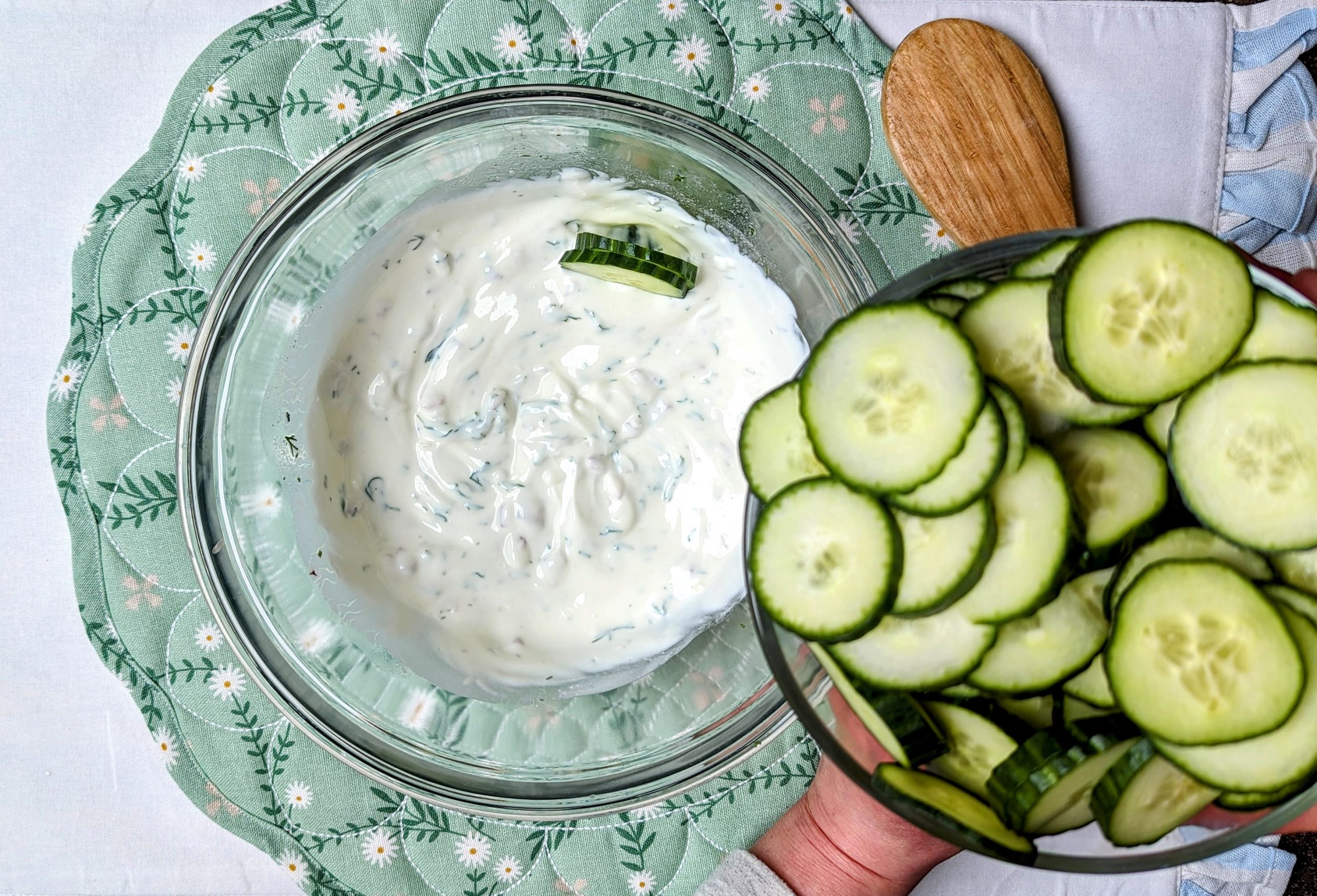 adding cucmbers to the dressing