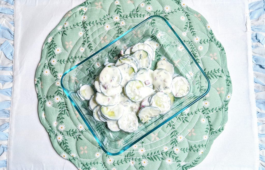 cucumber sour cream salad in storage container