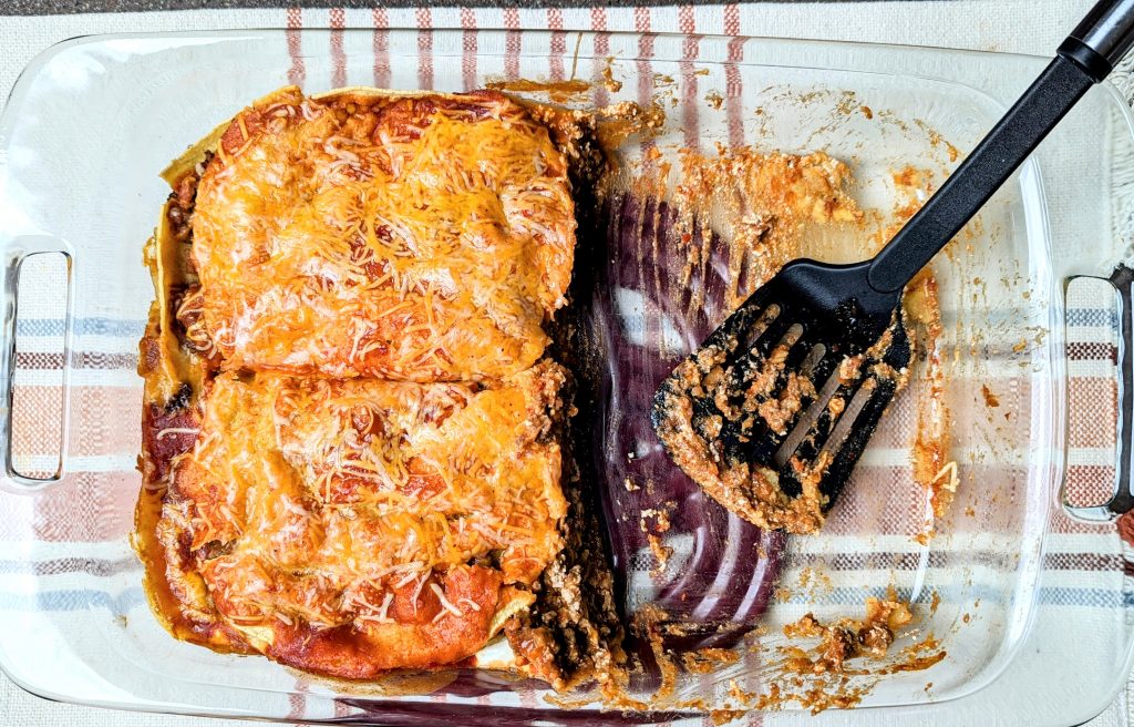 three layer cheesy taco bake in dish