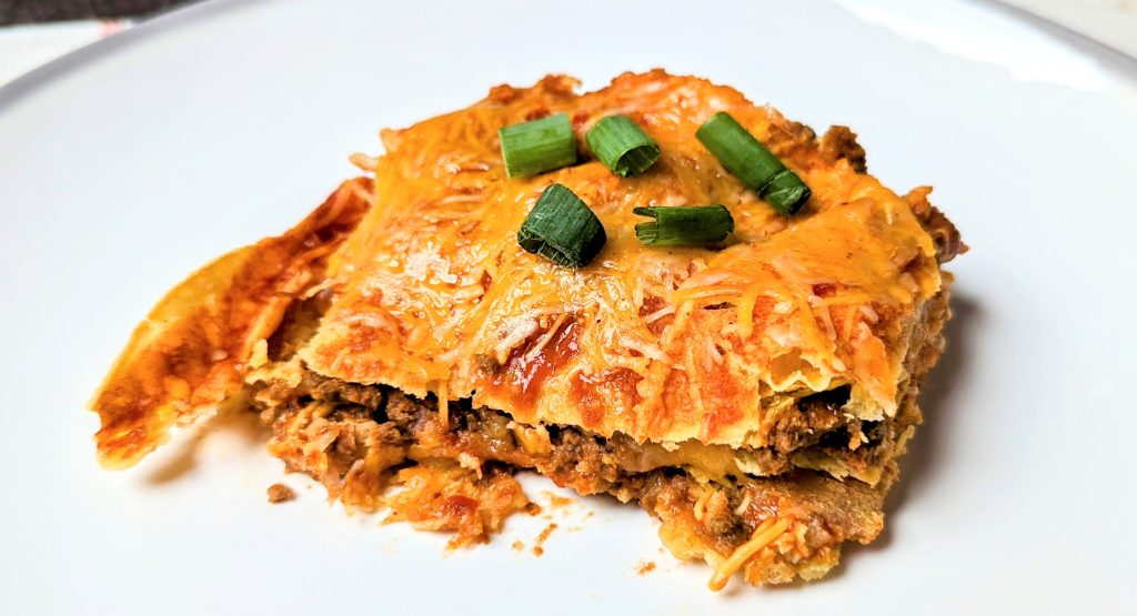 three layer cheesy taco bake serving