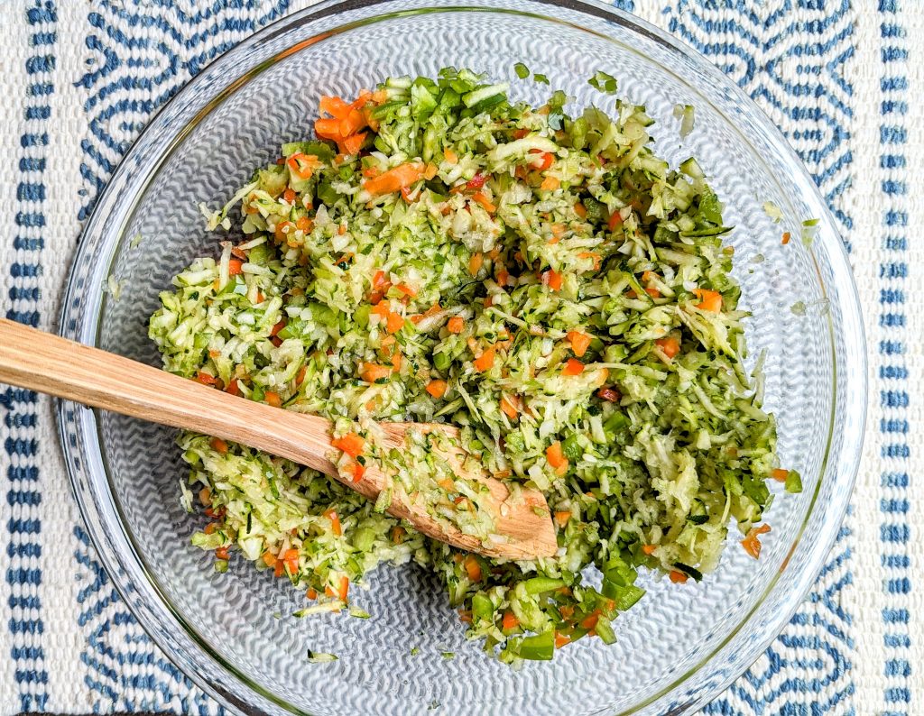 zucchini slaw in mixing bowl