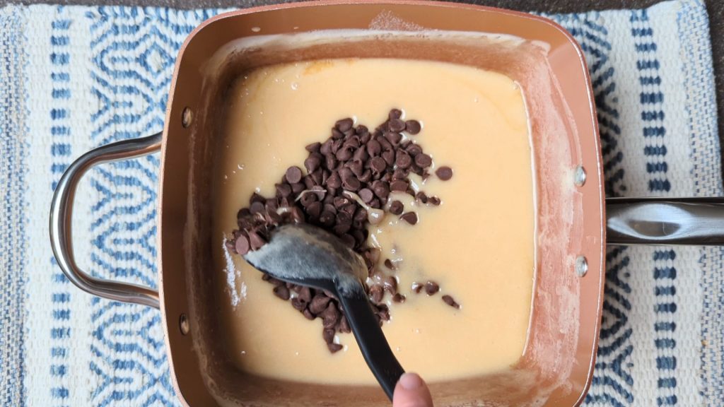 stirring chocolate into the pot