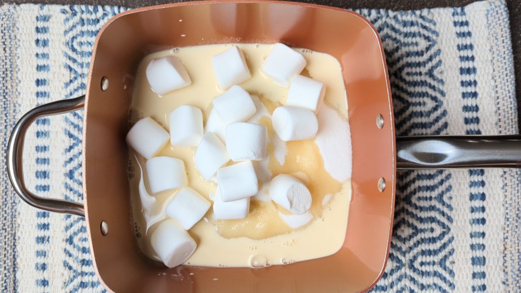 marshmallows in pan with milk and sugar