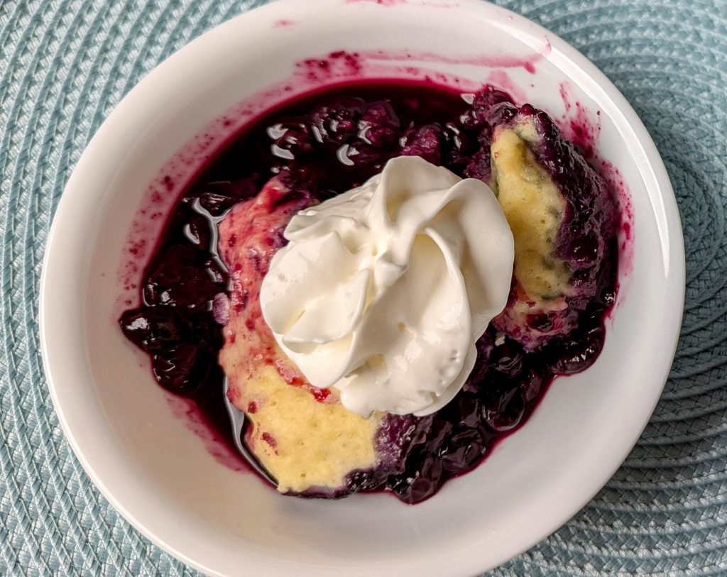 stovetop blueberry grunt in serving bowl