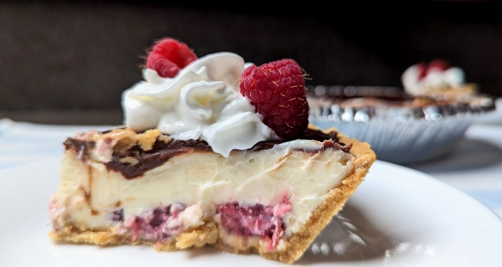 slice of chocolate raspberry cheesecake with suggested garnish