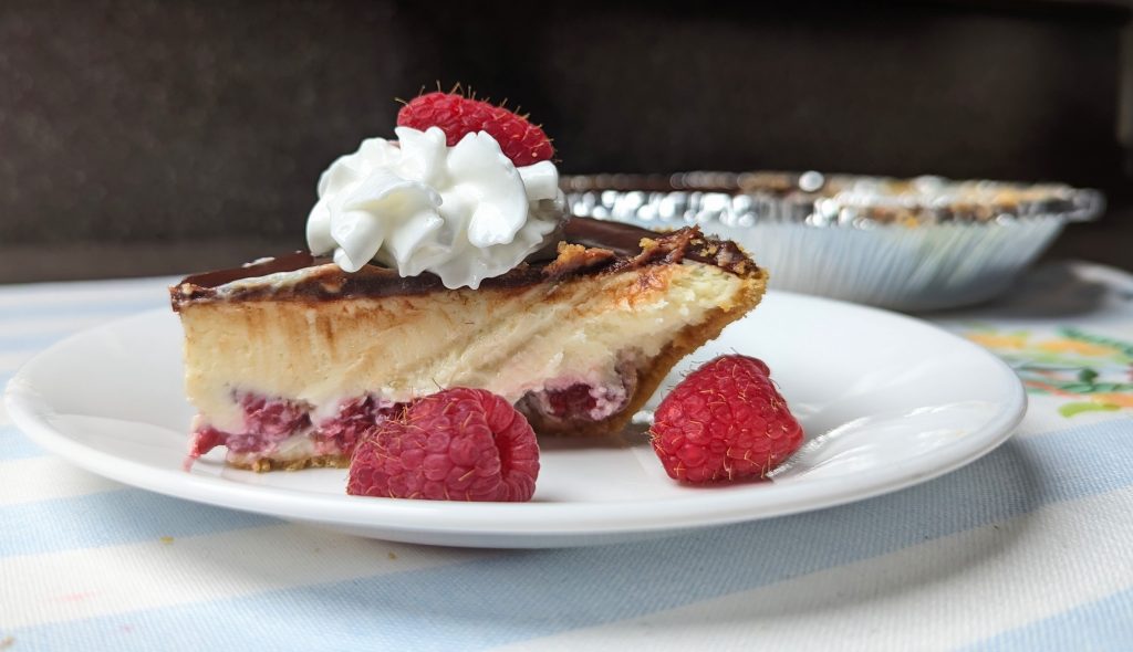 chocolate raspberry cheesecake on plate