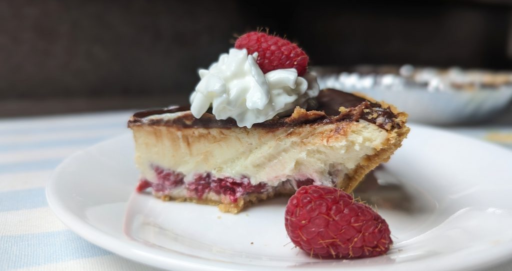 slice of chocolate raspberry cheesecake with suggested garnish