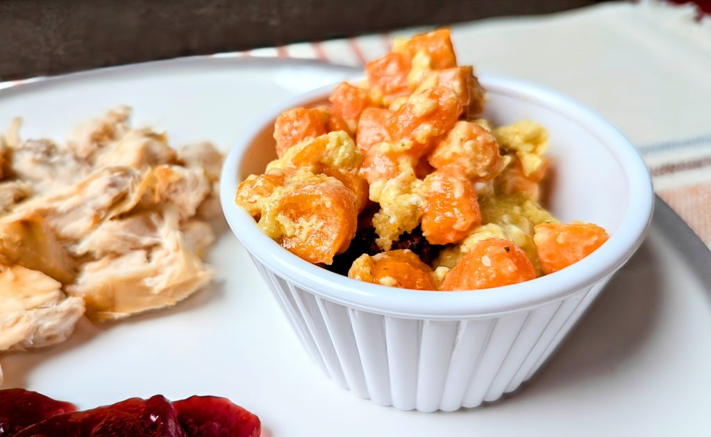 creamy cheesy carrot casserole in dish