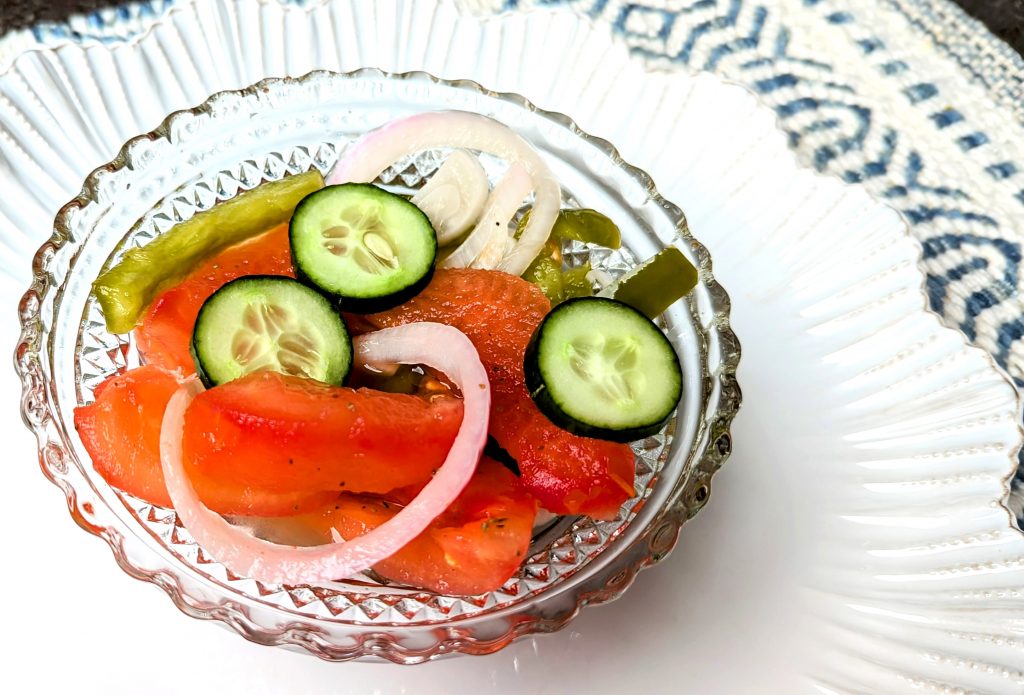 fire and ice tomato salad in bowl with cucumbers