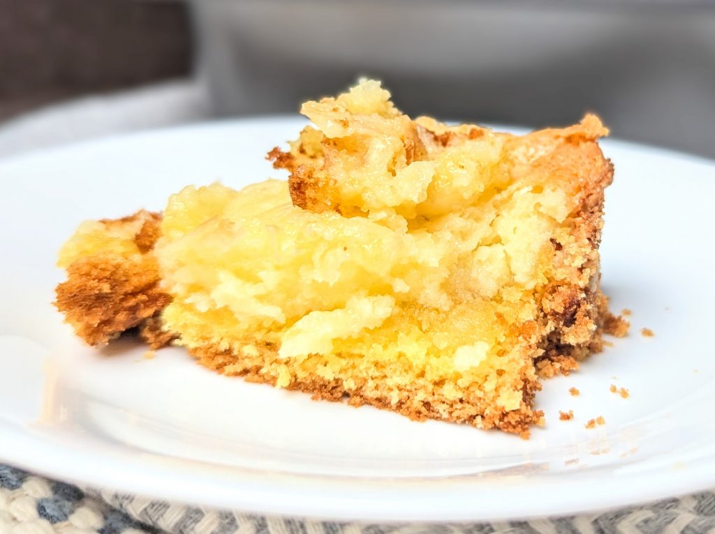 slice of ooey gooey butter cake on plate