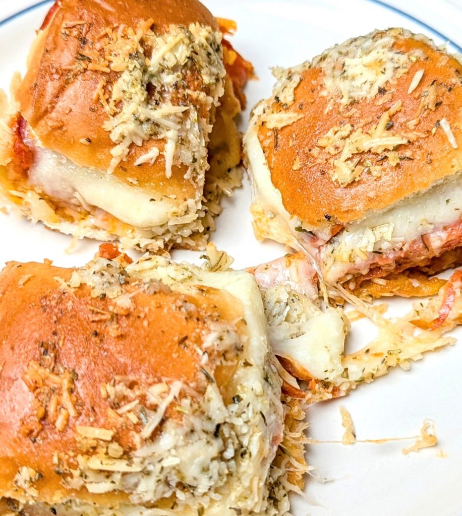 cheesy pepperoni pizza sliders on plate