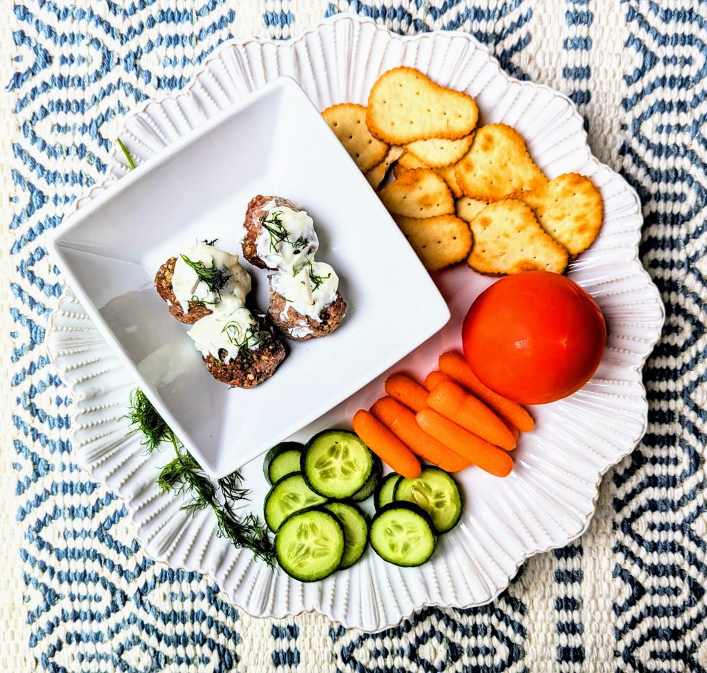 swedish meatballs with dill sauce appetizer on serving tray