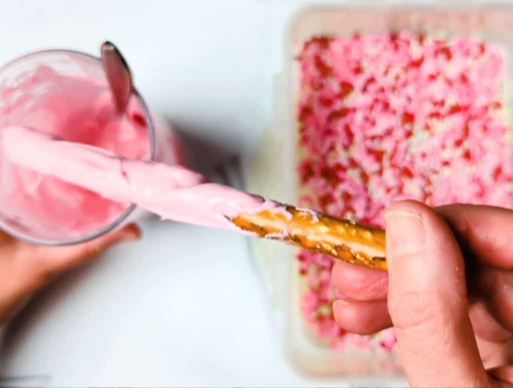 dipping pretzel in glass