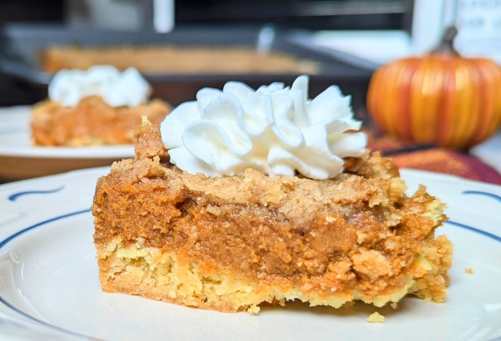 pumpkin spice crumble on plate with whipped cream