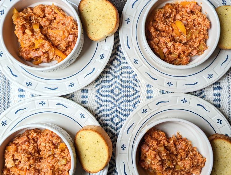 Ham and Chicken Jambalaya in bowls with bread