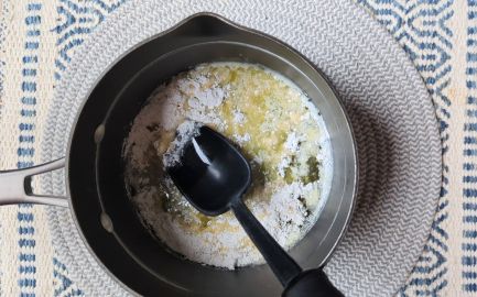 cheddar parmesan mac and cheese in saucepan