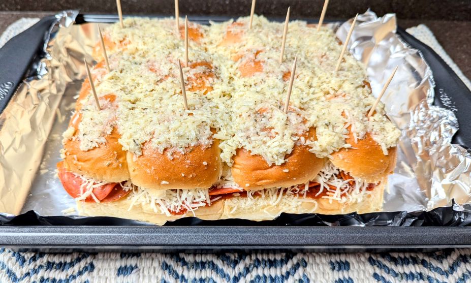 cheesy pepperoni pizza sliders on pan