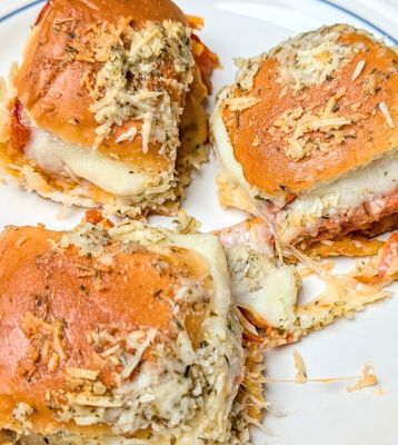 cheesy pepperoni pizza sliders on plate