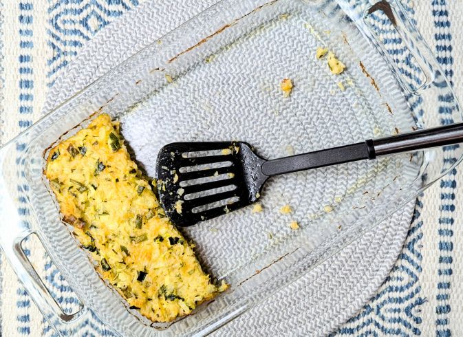 spatula with cheesy rice zucchini casserole