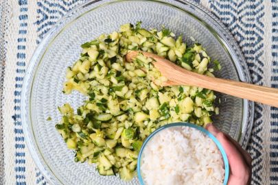 adding rice to the bowl