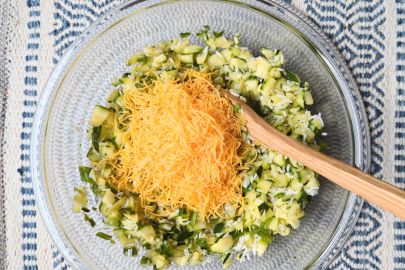 cheesy rice zucchini casserole in mixing bowl