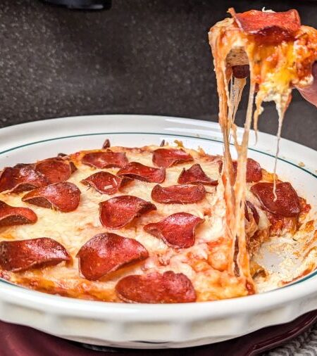 pepperoni pizza dip with a cracker