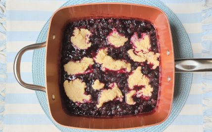 stovetop blueberry grunt with dumplings added to the pan