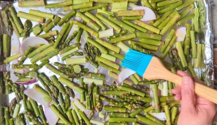 spreading oil on vegetables