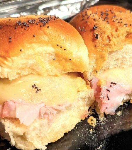 ham and swiss cheese sliders on pan