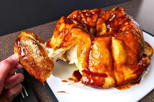 pulling off a piece of make ahead monkey bread