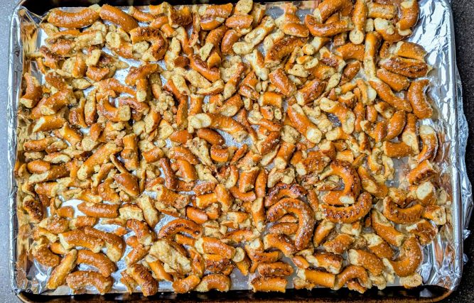 parmesan herb seasoned pretzels on pan