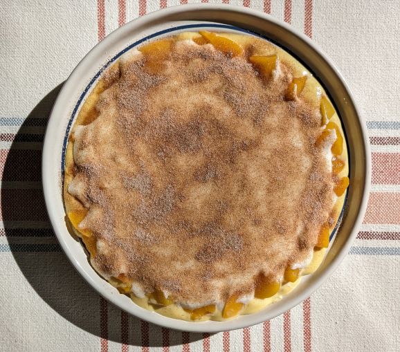 peaches and cream cake before going in the oven.