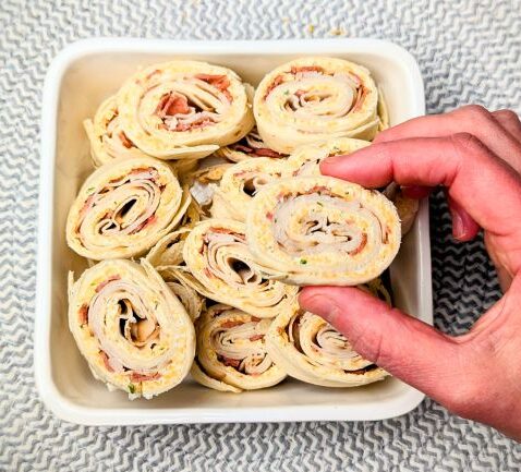 eating turkey and cheese pinwheels