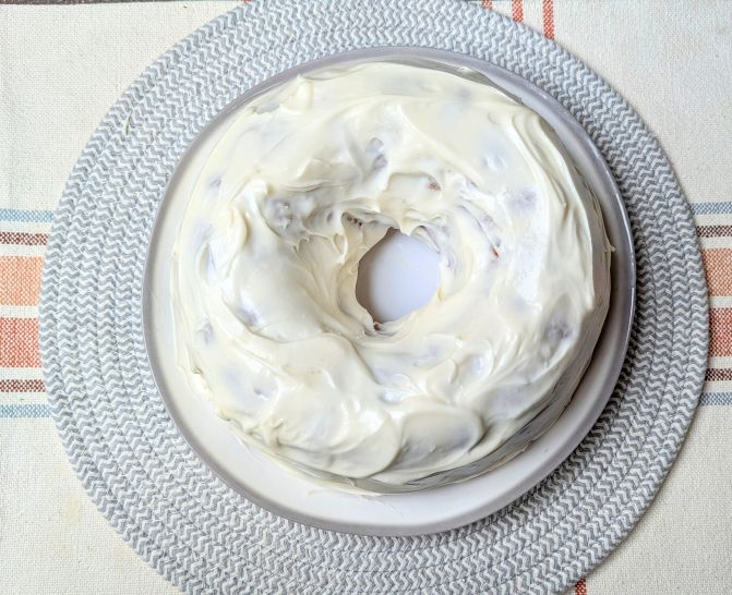 carrot bundt cake frosted with cream cheese icing