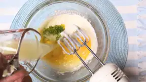 mixing cheesecake ingredients