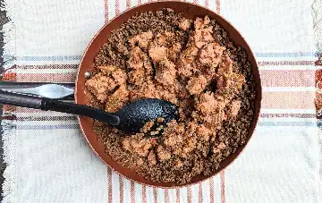 adding refried beans
