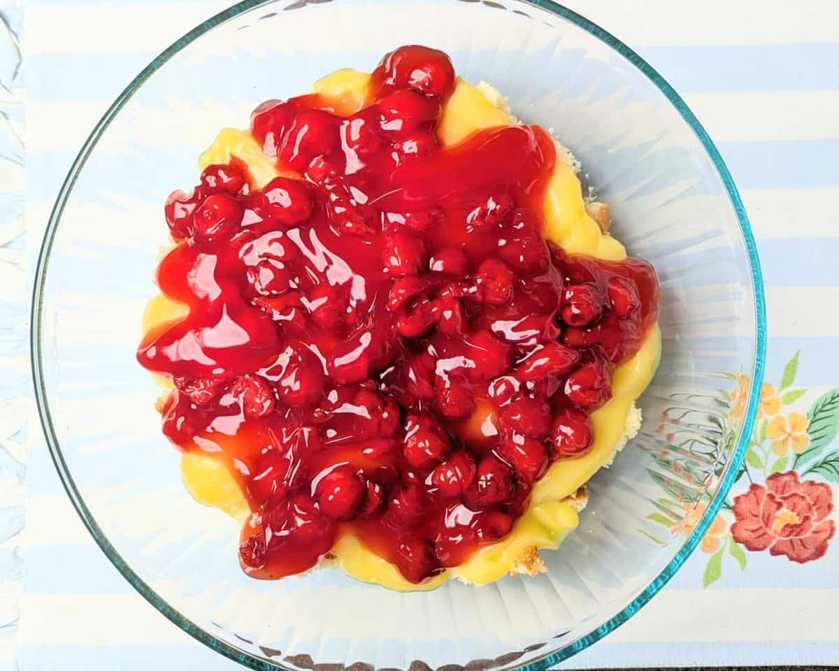 cherry pie filling on top of yellow cake