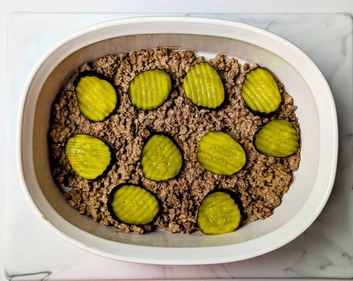 in casserole dish with pickles