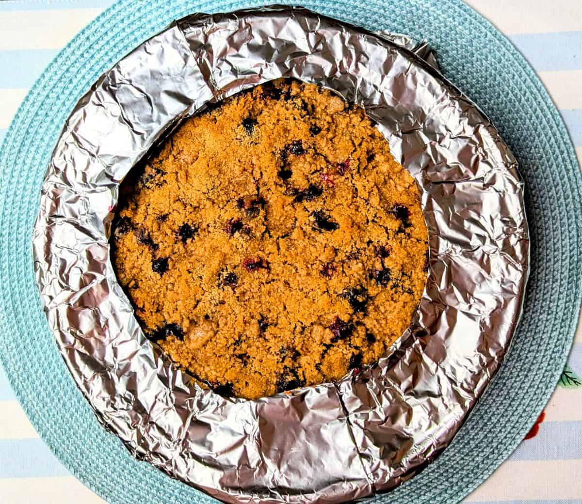 DIY pie shield halfway through baking